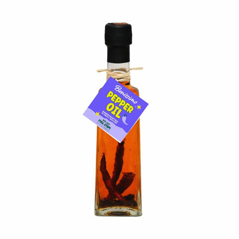 Bottle of Benissimo Pepper Oil on a white background