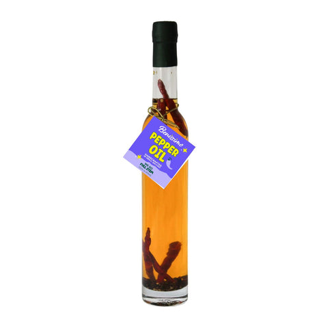 Bottle of Benissimo Pepper Oil on a white background